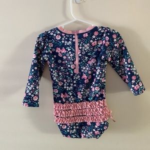 Ruffle Butts long-sleeve rashguard swim suit